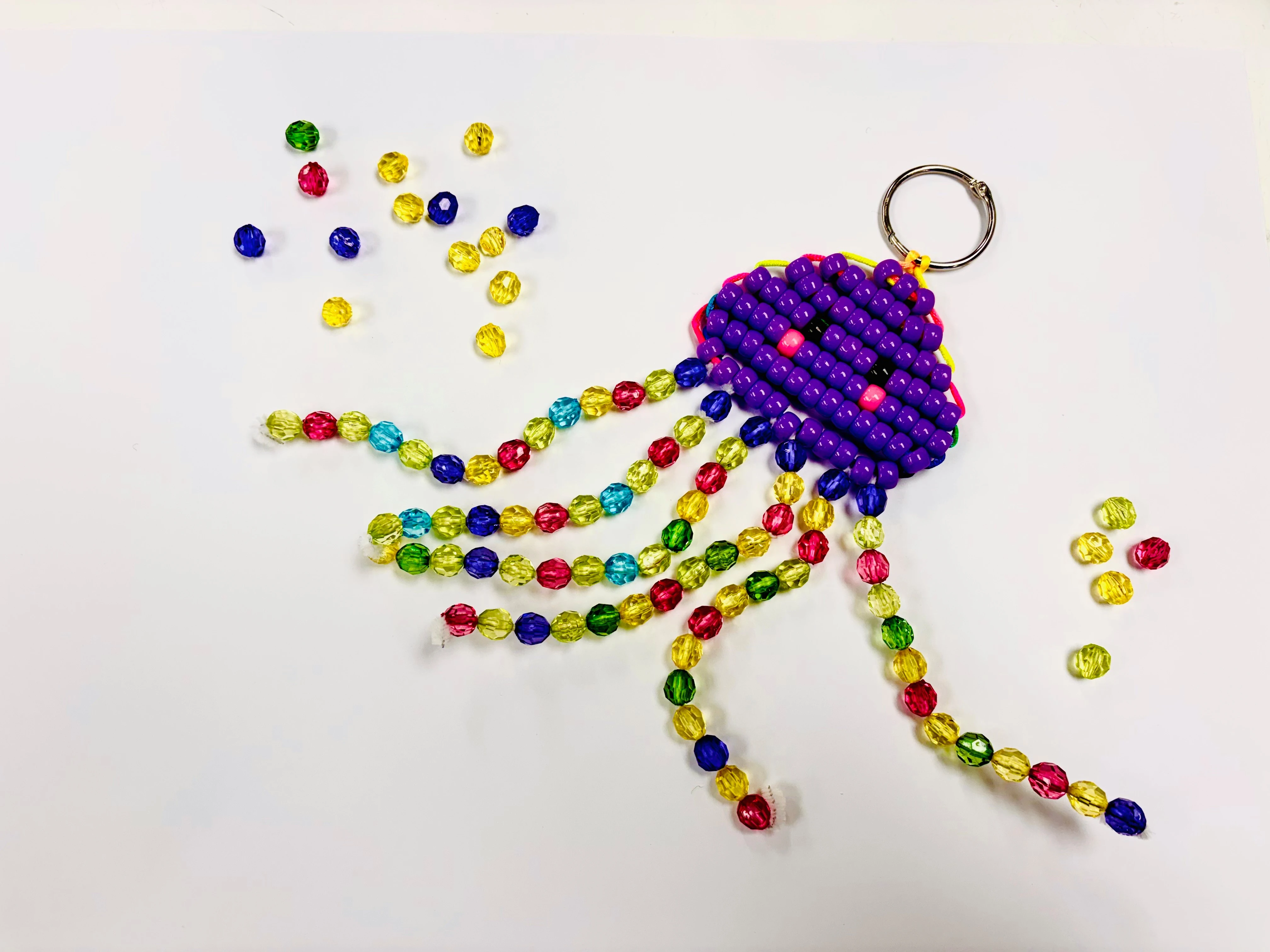 Jellyfish made out of colourful beads.